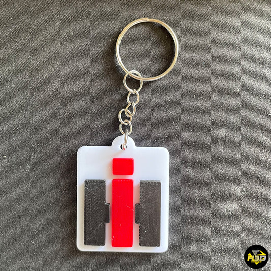 Porte-clé IH en relief inspiré des tracteurs International Harvester